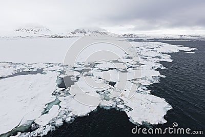 Iceberg floats in the polar sea of â€‹â€‹Svalbard, Spitsbergen, Stock Photo